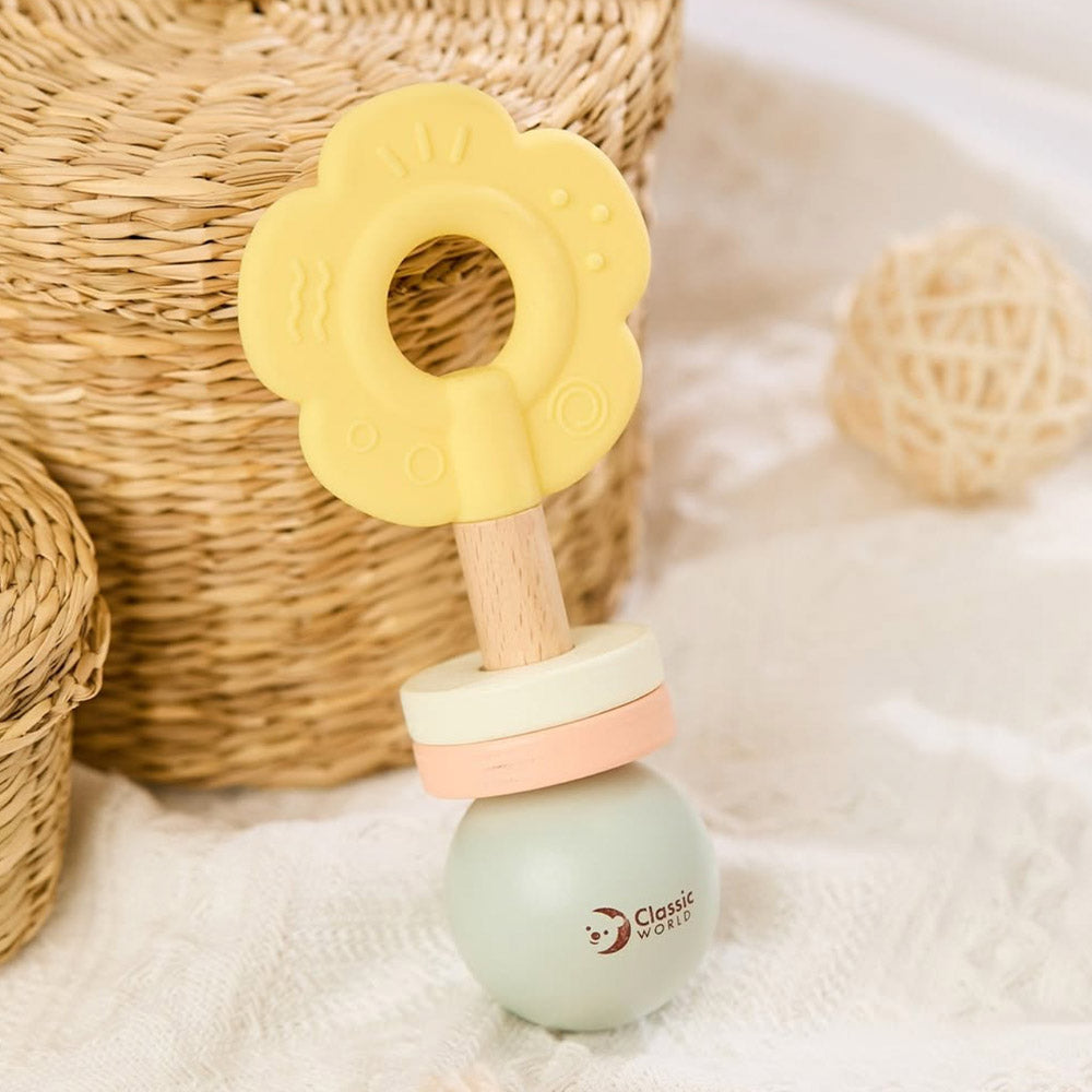 Baby teething toy with wooden base and yellow flower-shaped top. Classic World Flower Grasping baby toy. MOD & TOD