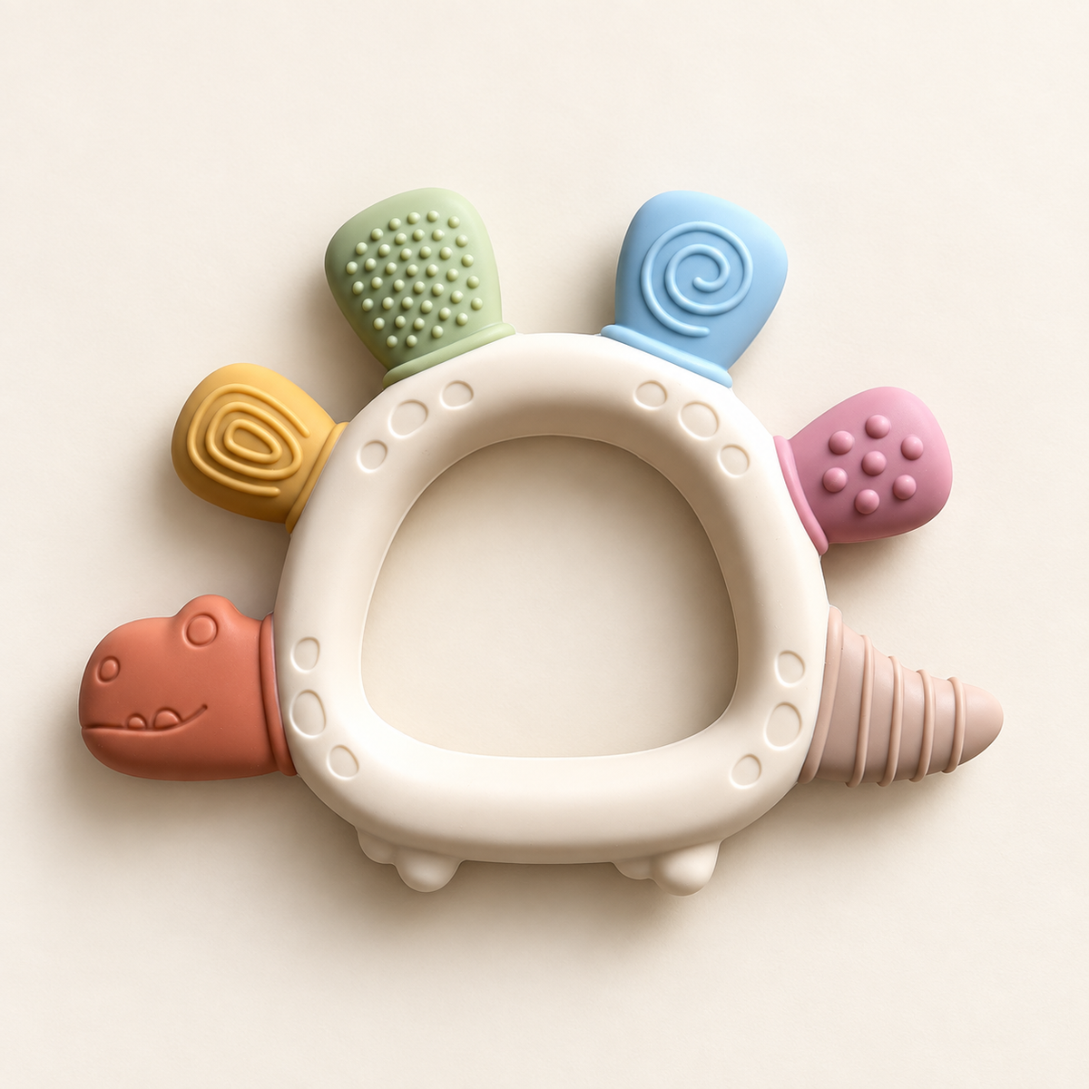 River & Oak Trading Dottie the Dino Silicone Teether | Silicone Teething Toy for Baby | modandtod.com