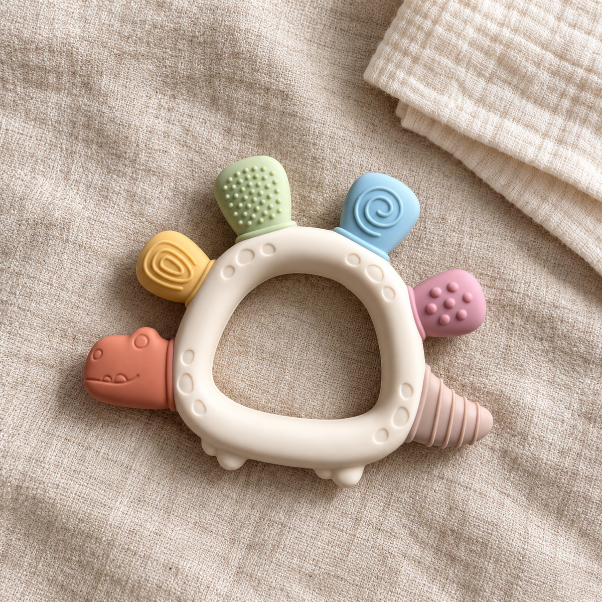 River & Oak Trading Dottie the Dino Silicone Teether | Silicone Teething Toy for Baby | modandtod.com
