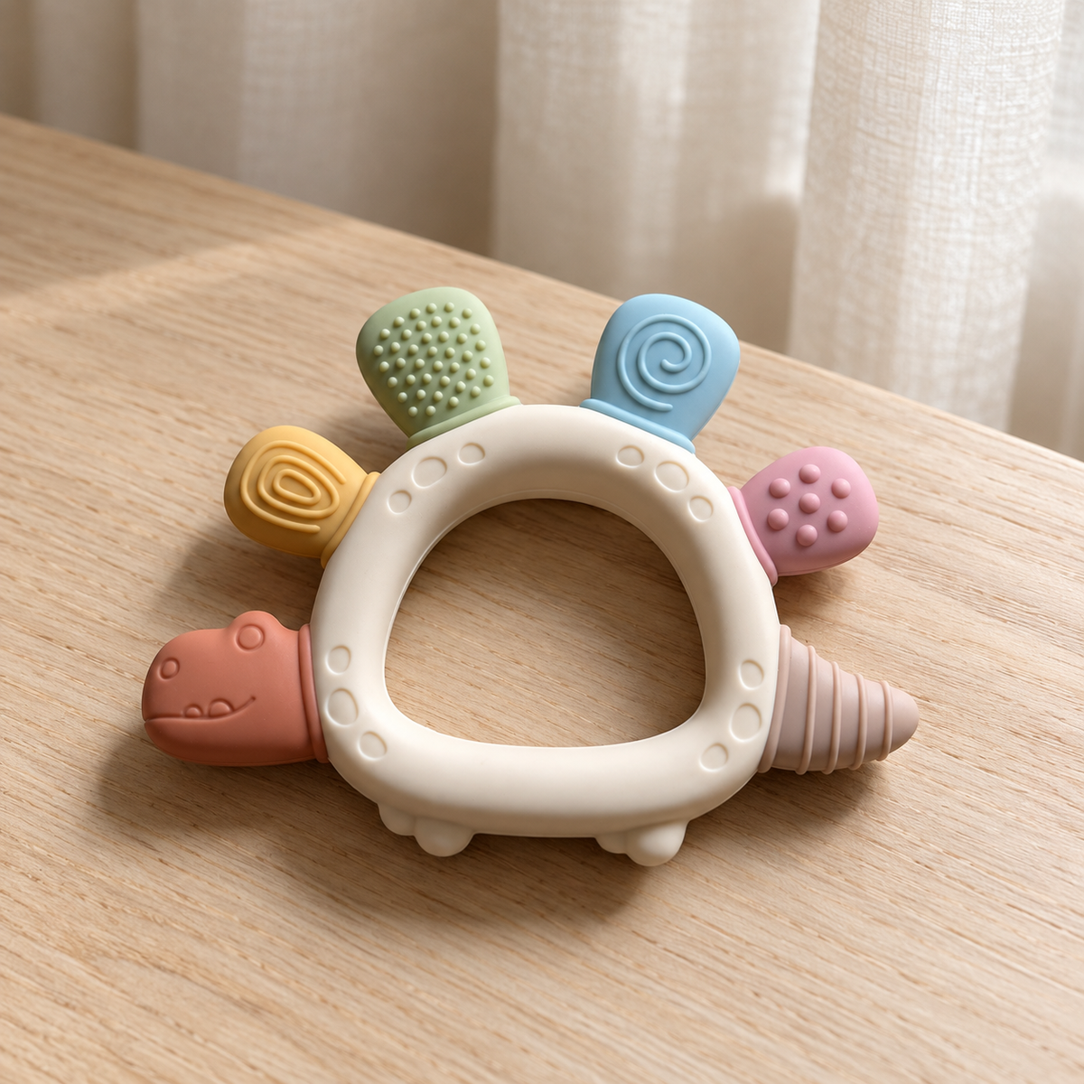 River & Oak Trading Dottie the Dino Silicone Teether | Silicone Teething Toy for Baby | modandtod.com